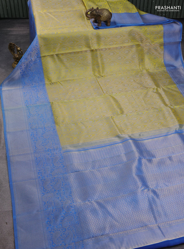 Pure kanchipuram silk saree lime yellow and blue with allover zari woven self emboss pattern and long paisley zari woven border
