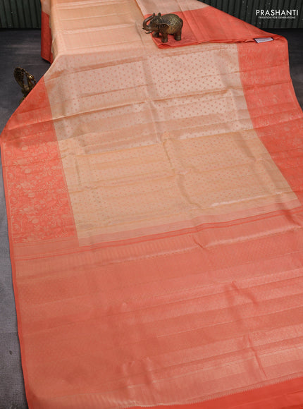 Pure kanchipuram silk saree cream and peach shade with allover self emboss pattern and long rich zari woven border