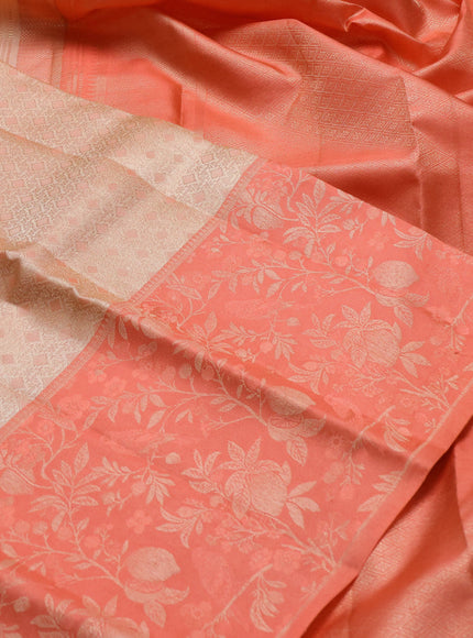 Pure kanchipuram silk saree cream and peach shade with allover self emboss pattern and long rich zari woven border