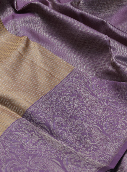 Pure kanchipuram silk saree beige and pastel purple with allover self emboss pattern and rich paisley zari woven border
