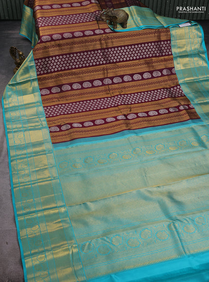 Pure kanchipuram silk saree wine shade and teal blue with allover silver & gold zari woven brocade weaves and long zari woven border