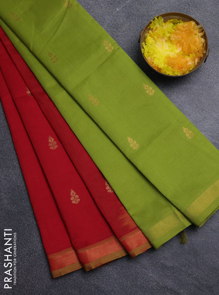 Semi silk cotton saree light green and red with allover zari woven buttas and zari woven border