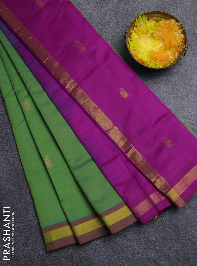 Semi silk cotton saree light green and purple with allover zari woven buttas and zari woven border
