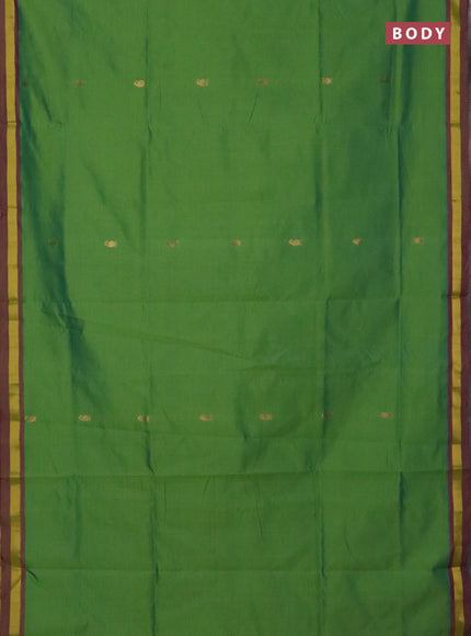 Semi silk cotton saree light green and purple with allover zari woven buttas and zari woven border