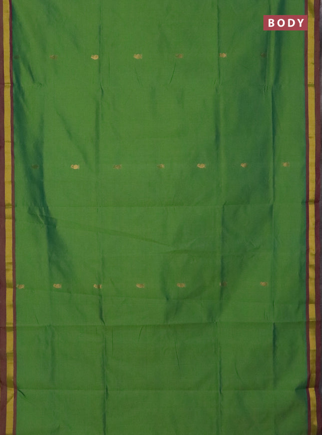 Semi silk cotton saree light green and purple with allover zari woven buttas and zari woven border