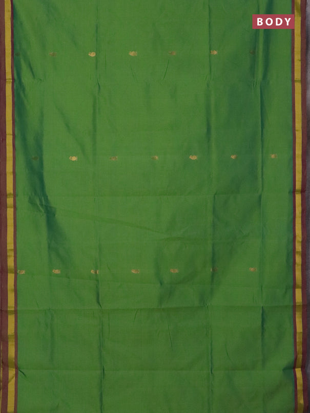 Semi silk cotton saree light green and purple with allover zari woven buttas and zari woven border