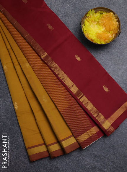 Semi silk cotton saree dark mustard and maroon with allover zari woven buttas and zari woven border