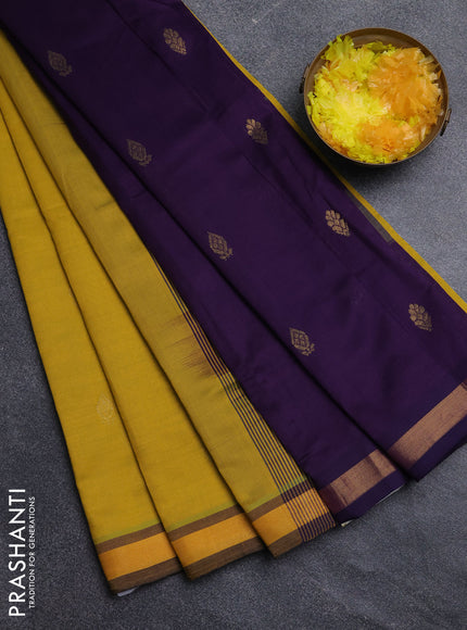 Semi silk cotton saree yellow and purple with plain body and zari woven border