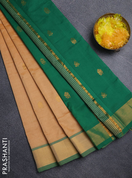Semi silk cotton saree pale orange and green with allover zari woven buttas and zari woven border
