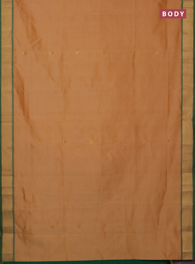Semi silk cotton saree pale orange and green with allover zari woven buttas and zari woven border