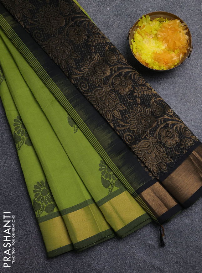 Semi silk cotton saree light green and black with zari woven buttas and zari woven border