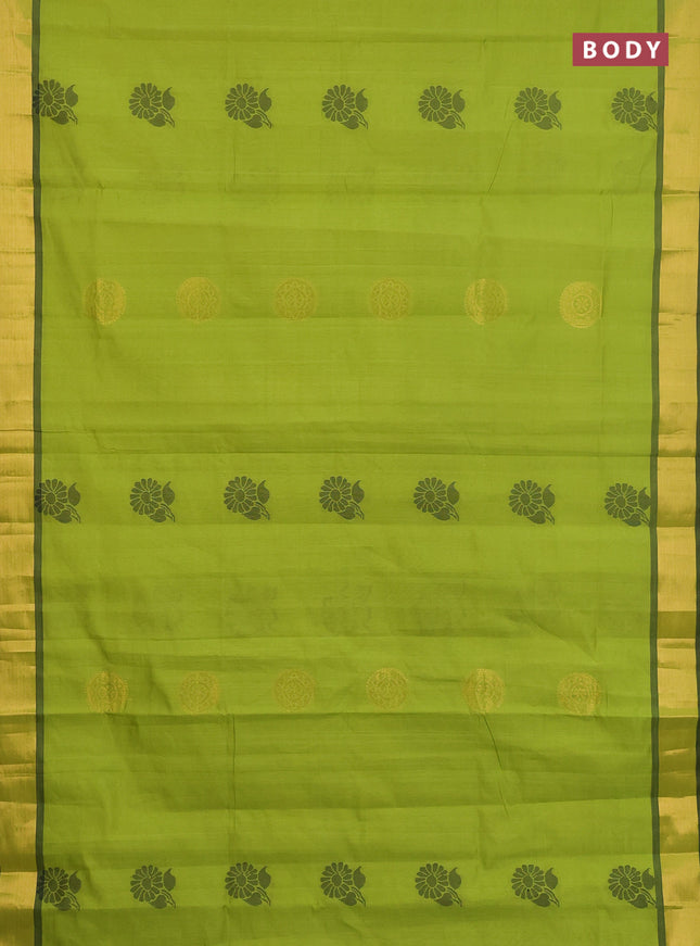 Semi silk cotton saree light green and black with zari woven buttas and zari woven border
