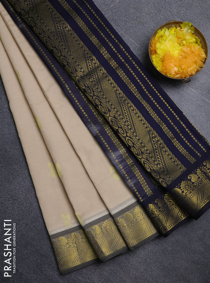 Semi silk cotton saree beige and navy blue with paisley zari woven buttas and zari woven border