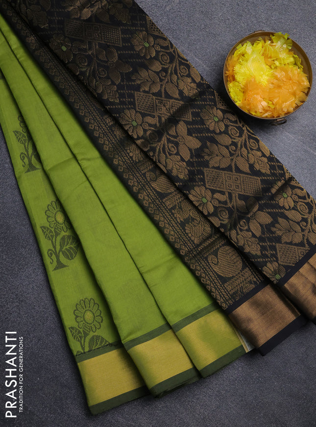 Semi silk cotton saree light green and black with zari woven buttas and zari woven border