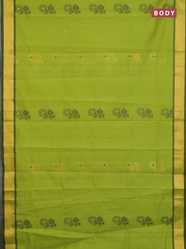 Semi silk cotton saree light green and black with zari woven buttas and zari woven border