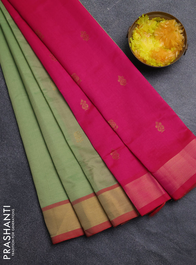 Semi silk cotton saree pastel green and pink with allover zari woven buttas and zari woven border
