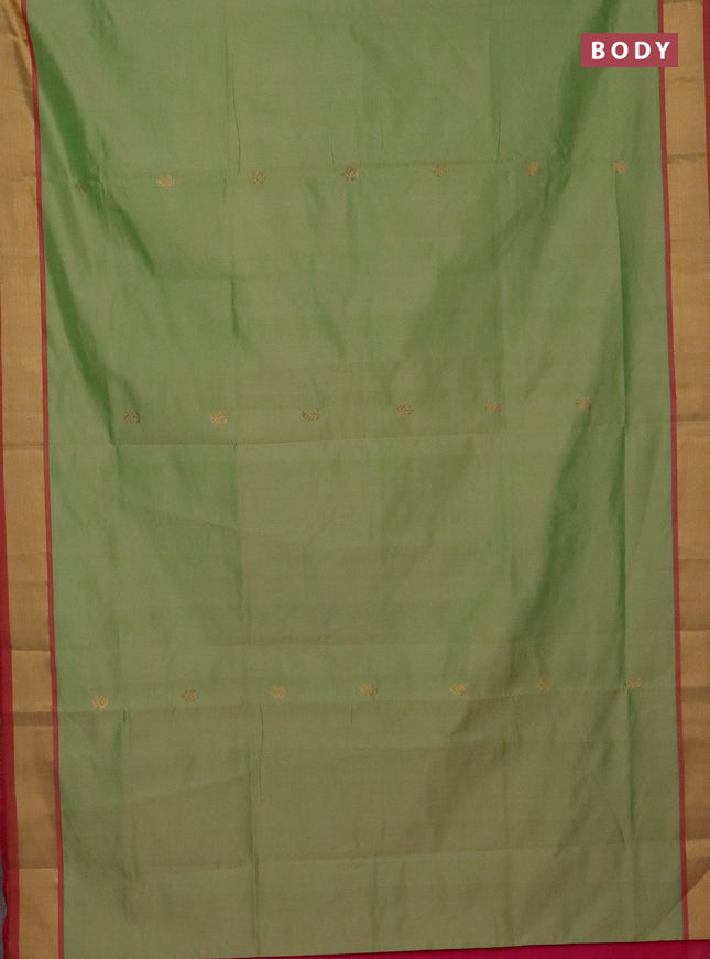 Semi silk cotton saree pastel green and pink with allover zari woven buttas and zari woven border