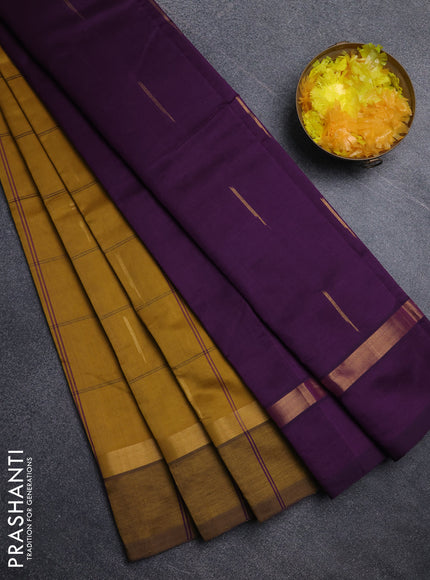 Semi silk cotton saree dark mustard and purple with allover thread checks & zari buttas and zari woven simple border