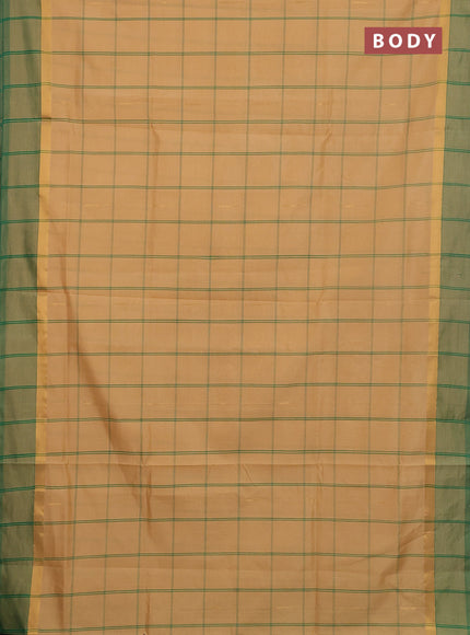 Semi silk cotton saree sandal and green with allover thread checks & zari buttas and zari woven simple border