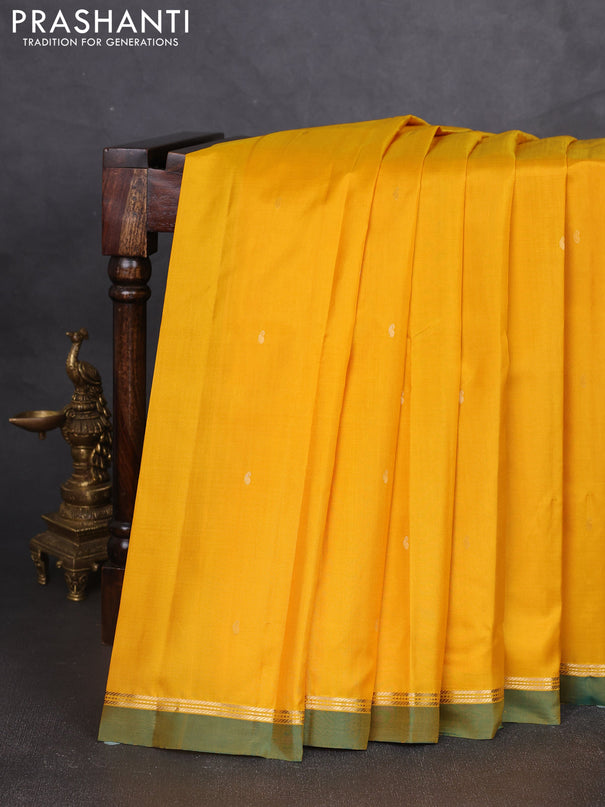 Pure kanchipram silk saree mango yellow and dual shade of green with zari woven buttas and zari woven simple border