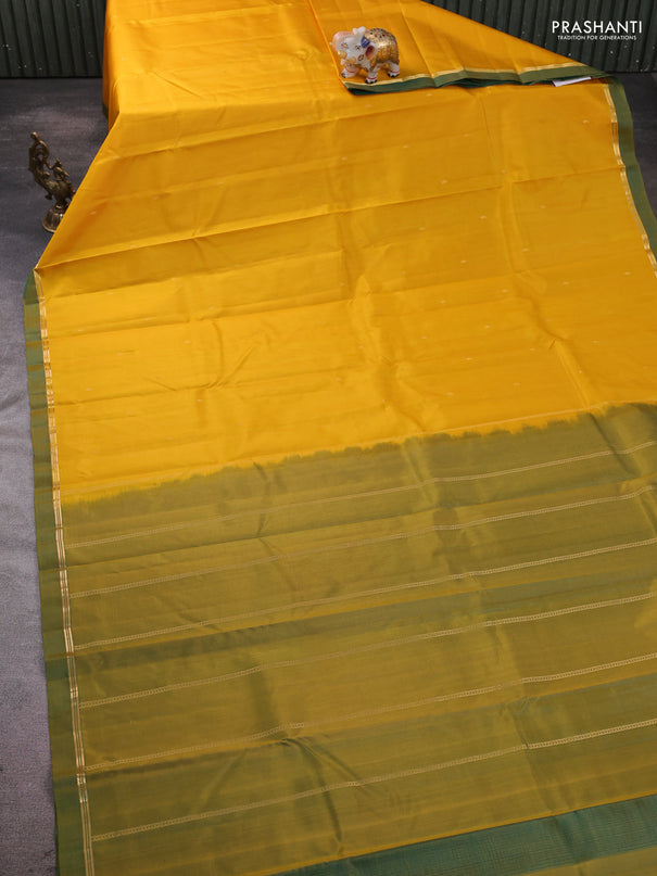 Pure kanchipram silk saree mango yellow and dual shade of green with zari woven buttas and zari woven simple border