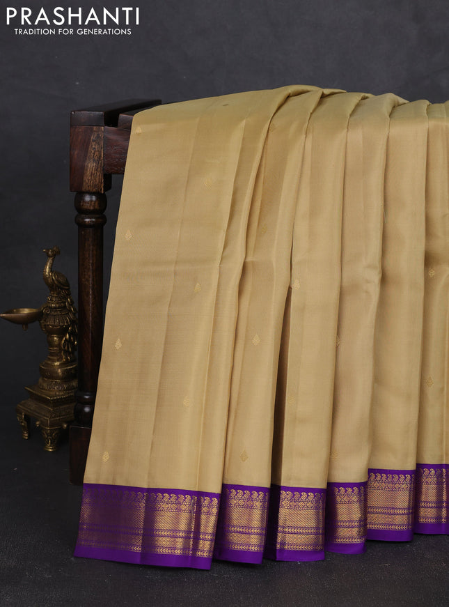 Pure kanchipram silk saree sandal and violet with zari woven buttas and zari woven korvai border