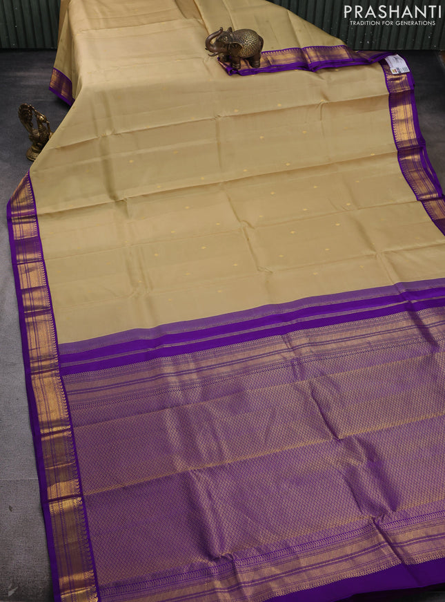 Pure kanchipram silk saree sandal and violet with zari woven buttas and zari woven korvai border