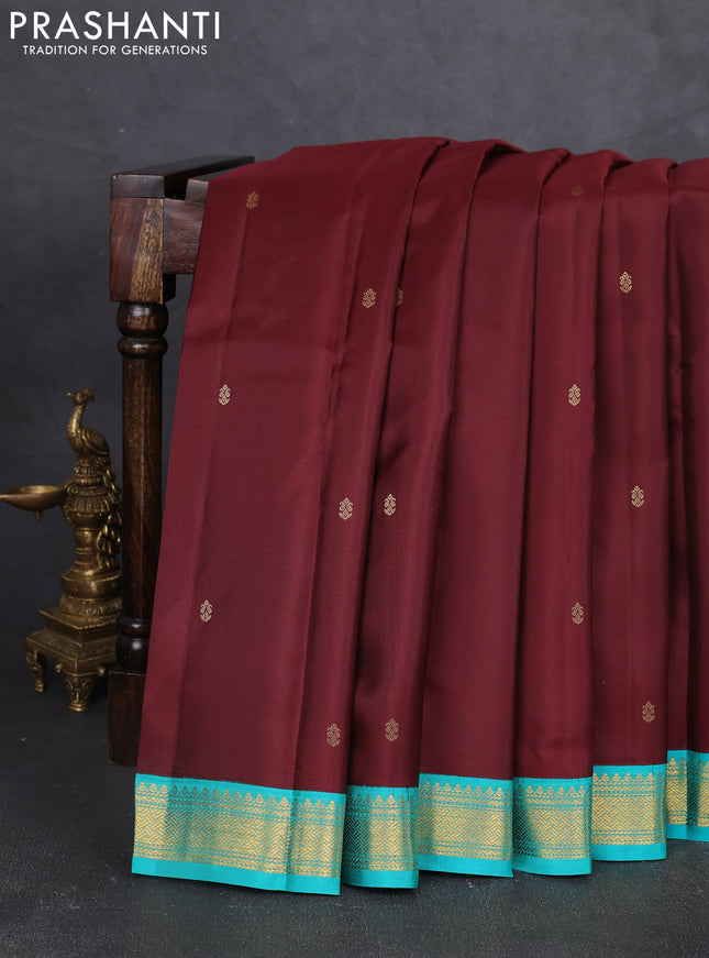 Pure kanchipram silk saree deep maroon and teal green with zari woven buttas and zari woven korvai border