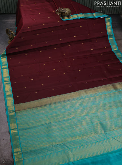 Pure kanchipram silk saree deep maroon and teal green with zari woven buttas and zari woven korvai border