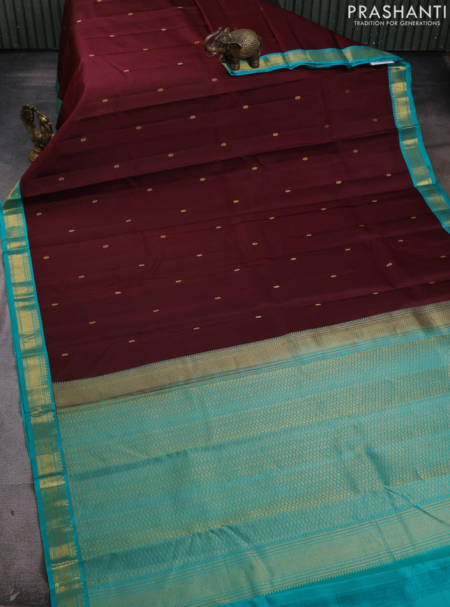 Pure kanchipram silk saree deep maroon and teal green with zari woven buttas and zari woven korvai border