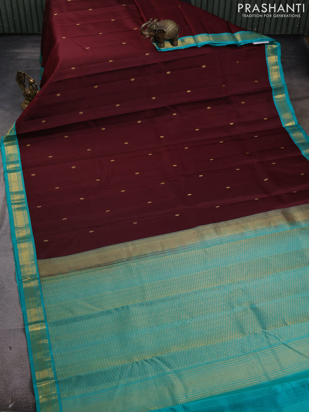 Pure kanchipram silk saree deep maroon and teal green with zari woven buttas and zari woven korvai border