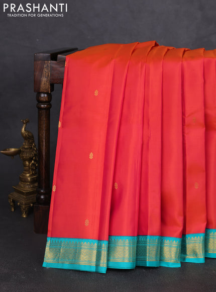 Pure kanchipram silk saree orange and teal green with zain woven buttas and zari woven korvai border