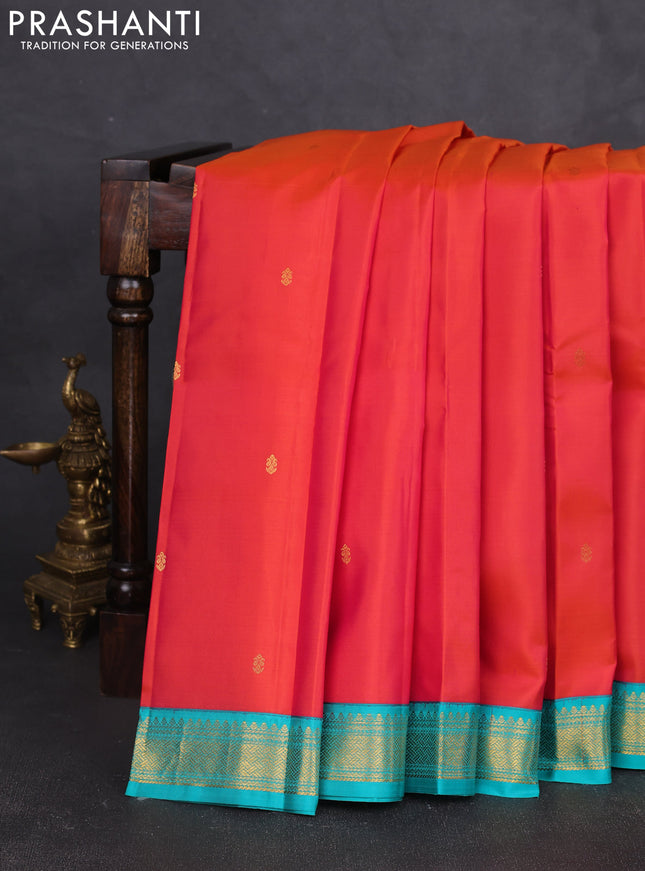 Pure kanchipram silk saree orange and teal green with zain woven buttas and zari woven korvai border