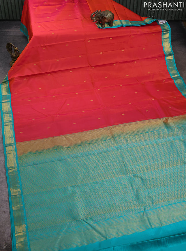 Pure kanchipram silk saree orange and teal green with zain woven buttas and zari woven korvai border