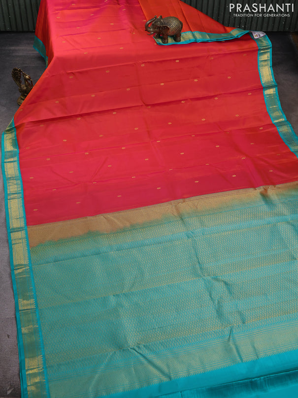 Pure kanchipram silk saree orange and teal green with zain woven buttas and zari woven korvai border