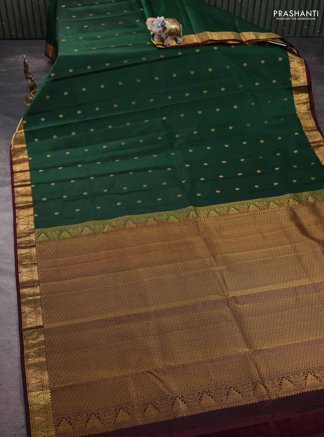 Pure kanchipram silk saree bottle green and wine shade with allover zari woven buttas and zari woven border