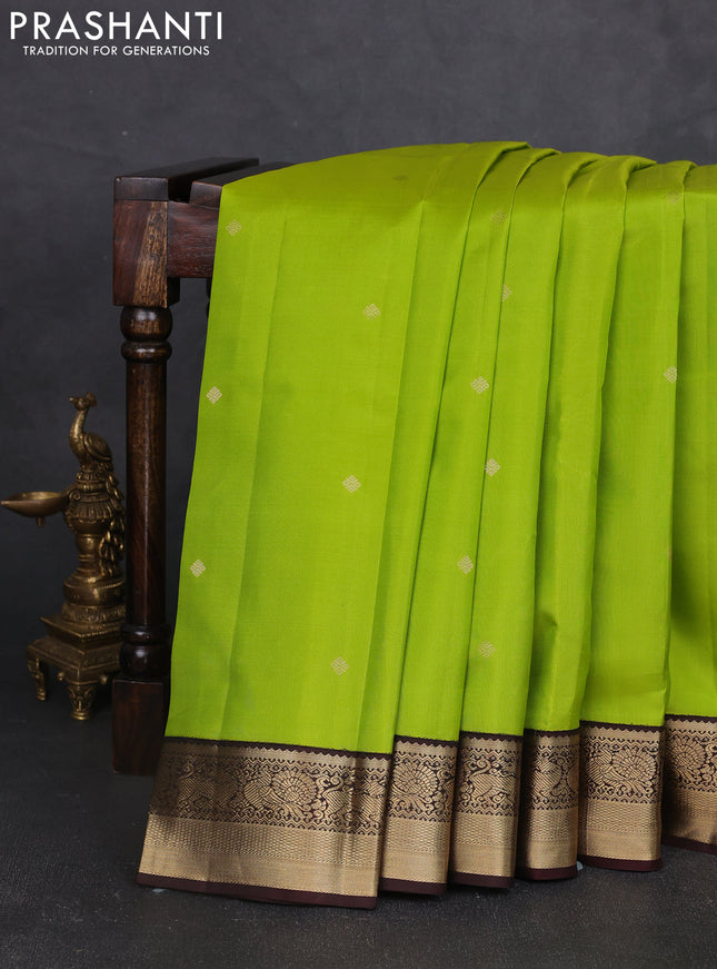 Pure kanchipram silk saree light green and coffee brown with zari woven buttas and zari woven korvai border