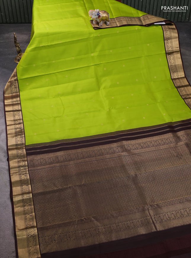 Pure kanchipram silk saree light green and coffee brown with zari woven buttas and zari woven korvai border