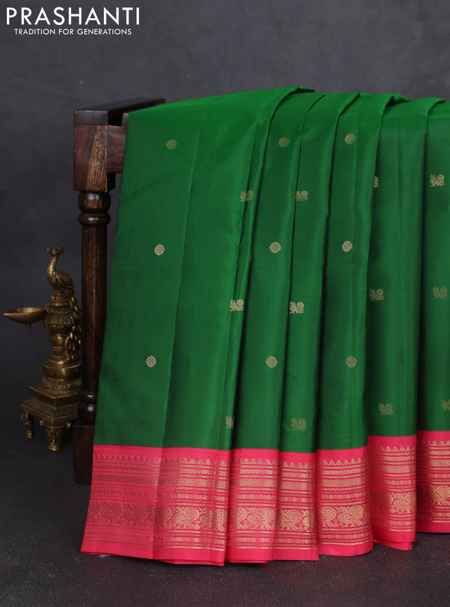 Pure kanchipram silk saree green and peach pink with zari woven buttas and zari woven korvai border