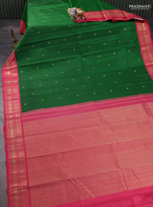 Pure kanchipram silk saree green and peach pink with zari woven buttas and zari woven korvai border
