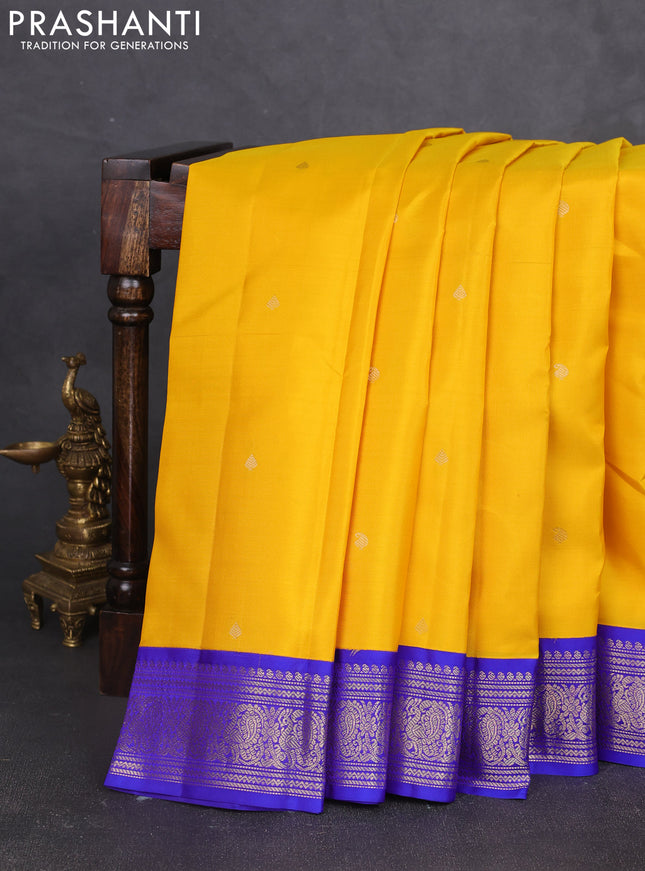 Pure kanchipram silk saree yellow and royal blue with zari woven buttas and zari woven korvai border