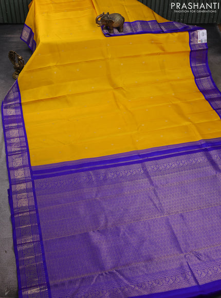 Pure kanchipram silk saree yellow and royal blue with zari woven buttas and zari woven korvai border