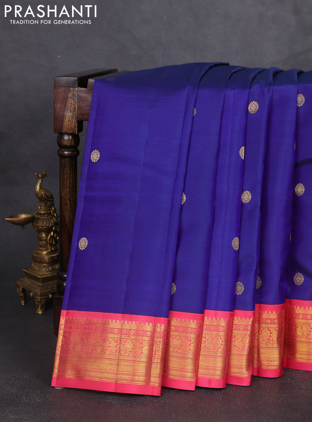 Pure kanchipram silk saree blue and peach pink with zari woven buttas and zari woven korvai border