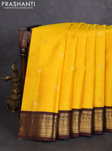 Pure kanchipram silk saree yellow and coffee brown with zari woven buttas and zari woven korvai border