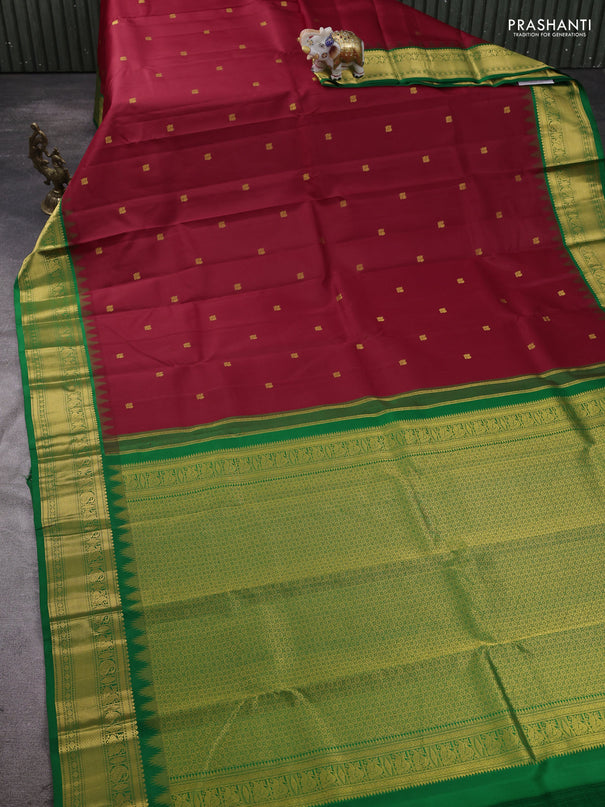 Pure kanchipram silk saree maroon and green with annam zari woven buttas and temple design zari woven border