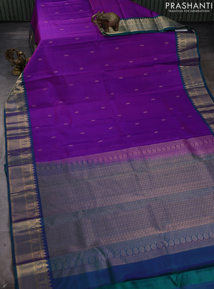 Pure kanchipram silk saree magenta pink and teal green with zari woven buttas and temple zari woven border
