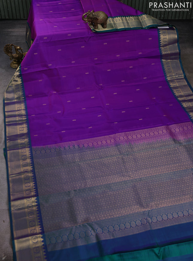 Pure kanchipram silk saree magenta pink and teal green with zari woven buttas and temple zari woven border