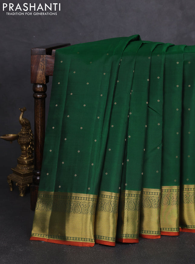 Pure kanchipram silk saree green and rustic orange with allover zari woven buttas and zari woven border