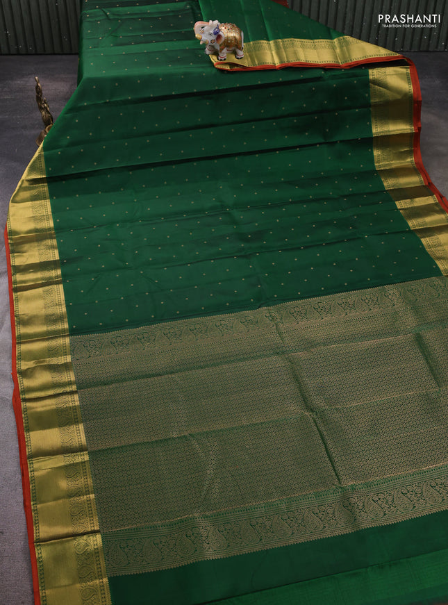Pure kanchipram silk saree green and rustic orange with allover zari woven buttas and zari woven border