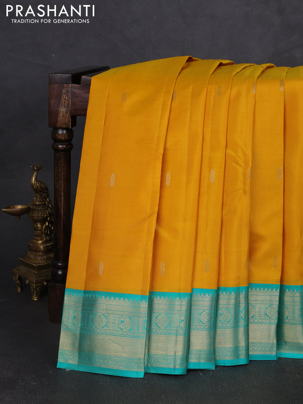 Pure kanchipram silk saree yellow and teal green with zari woven buttas and zari woven korvai border